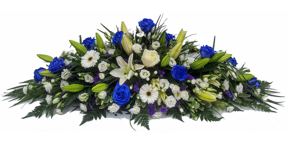 White Oriental Lily & Blue Rose Mixed Casket Spray
