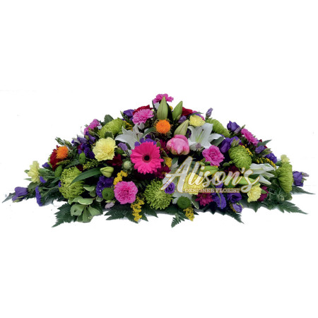 Florists choice vibrant casket spray