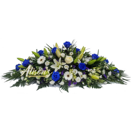 White oriental lily & blue rose casket spray