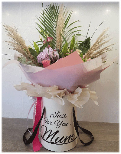 Hand-tied bouquet in tall hat box